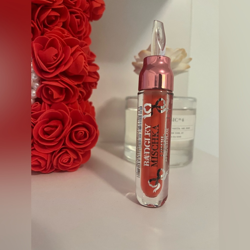 Badgley Mischka Lip Gloss in Vibrant Coral-Red